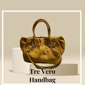 Tre Vero Handbag in a mustard. Has convertible strap for use as a shoulder bag.